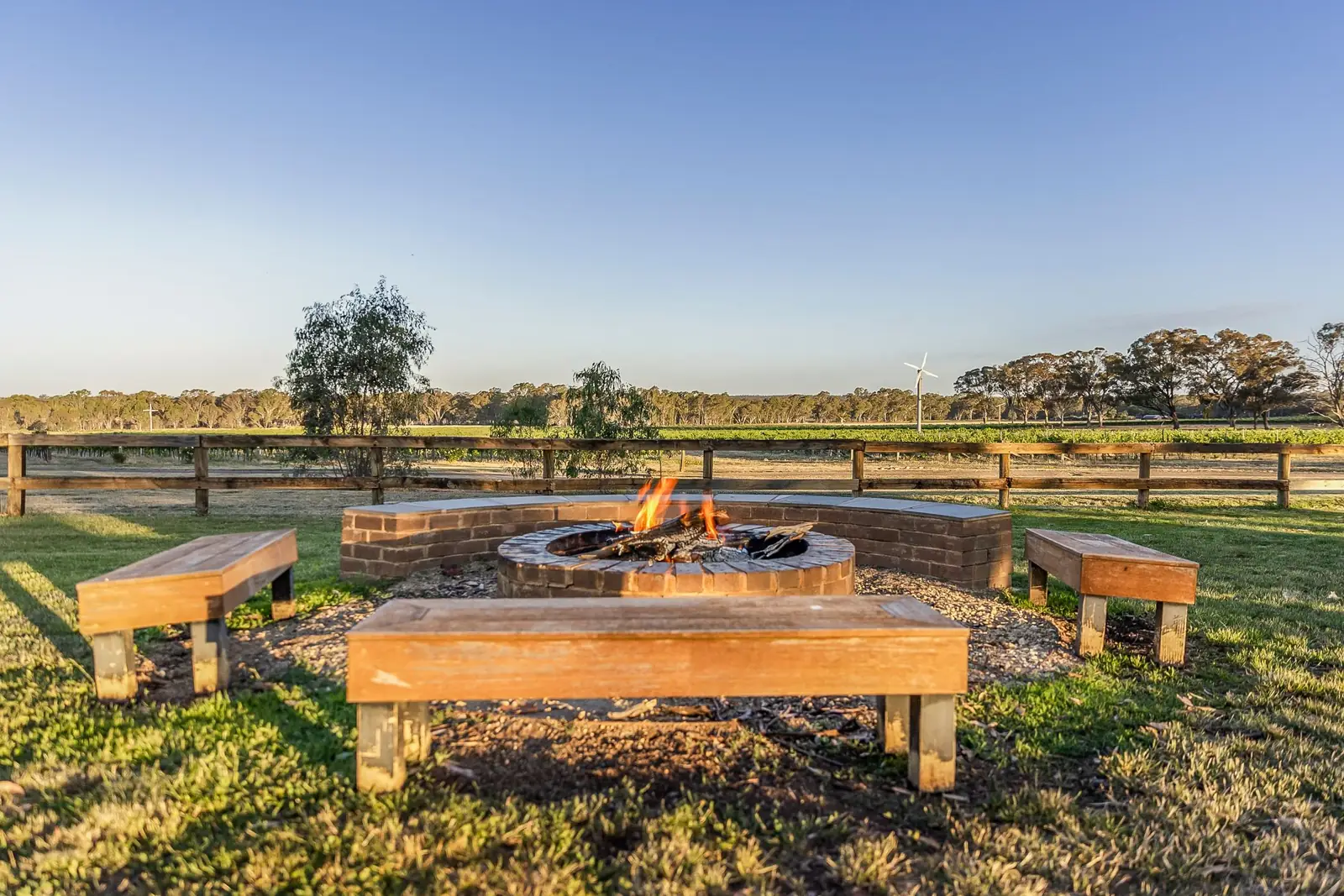 The shared fire pit and seating looking over the vineyard