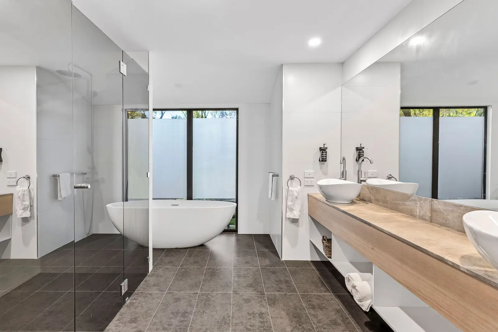 A king suite ensuite with a freestanding bath and double vanity